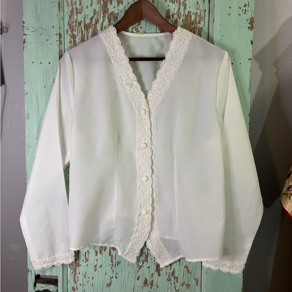 Women’s white sheer button-up blouse with lace trim